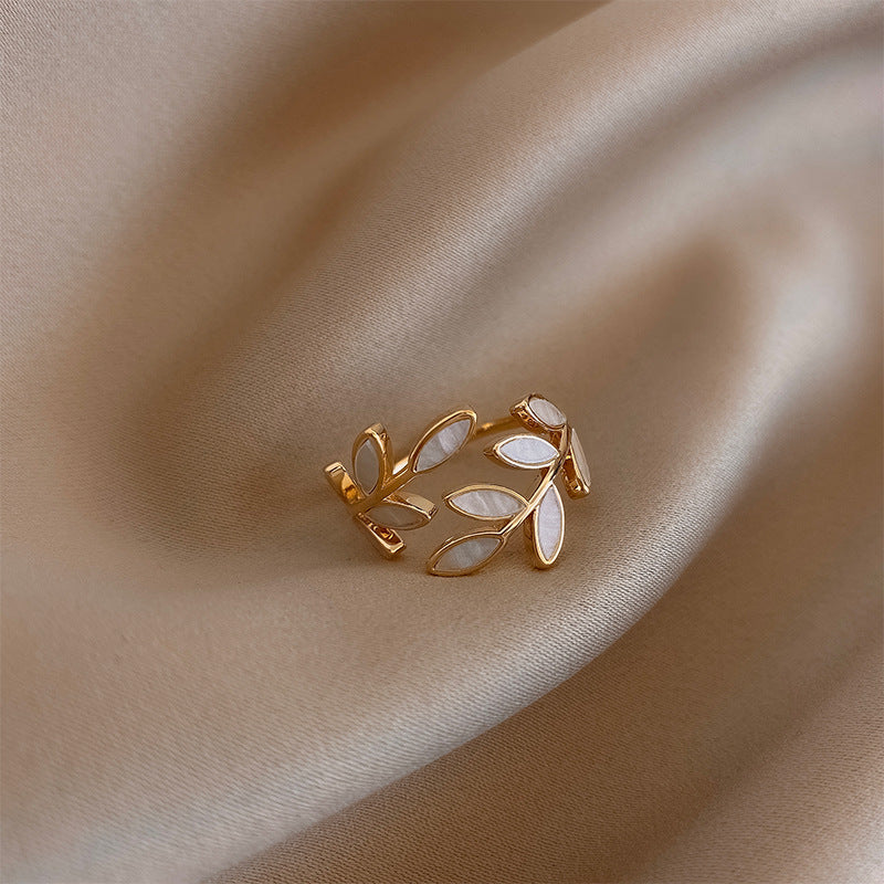 Adjustable Gold Ring with Leaf Details and Elegant White Opal Sparkle