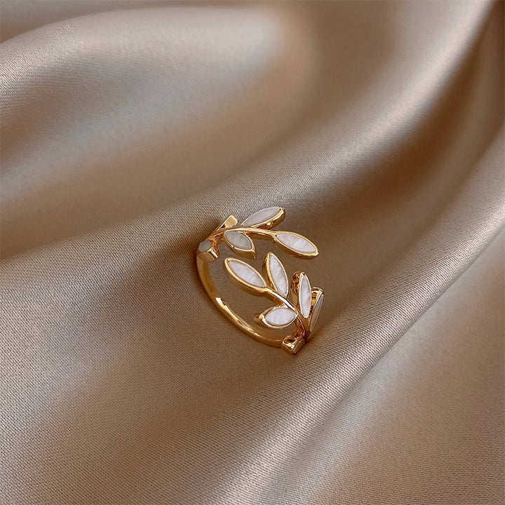 Adjustable Gold Ring with Leaf Details and Elegant White Opal Sparkle